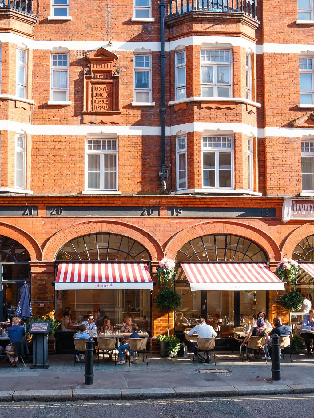 The front of Plants by Deliciously Ella restaurant showing alfresco dining