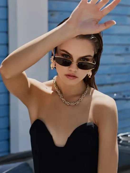 Woman wearing strapless black dress and black sunglasses