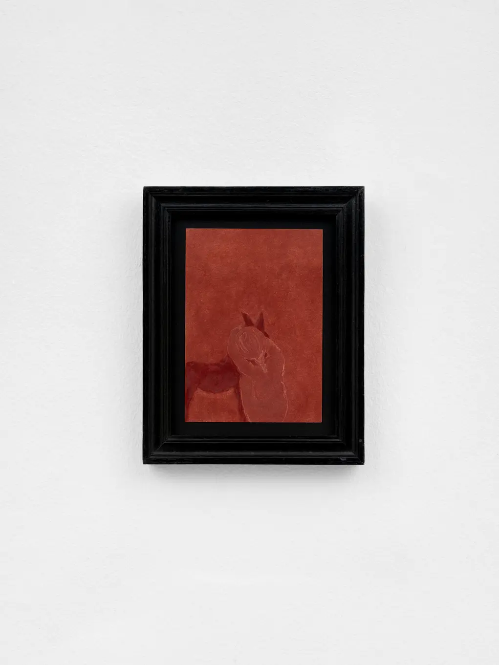 A red picture with a black frame on a white background